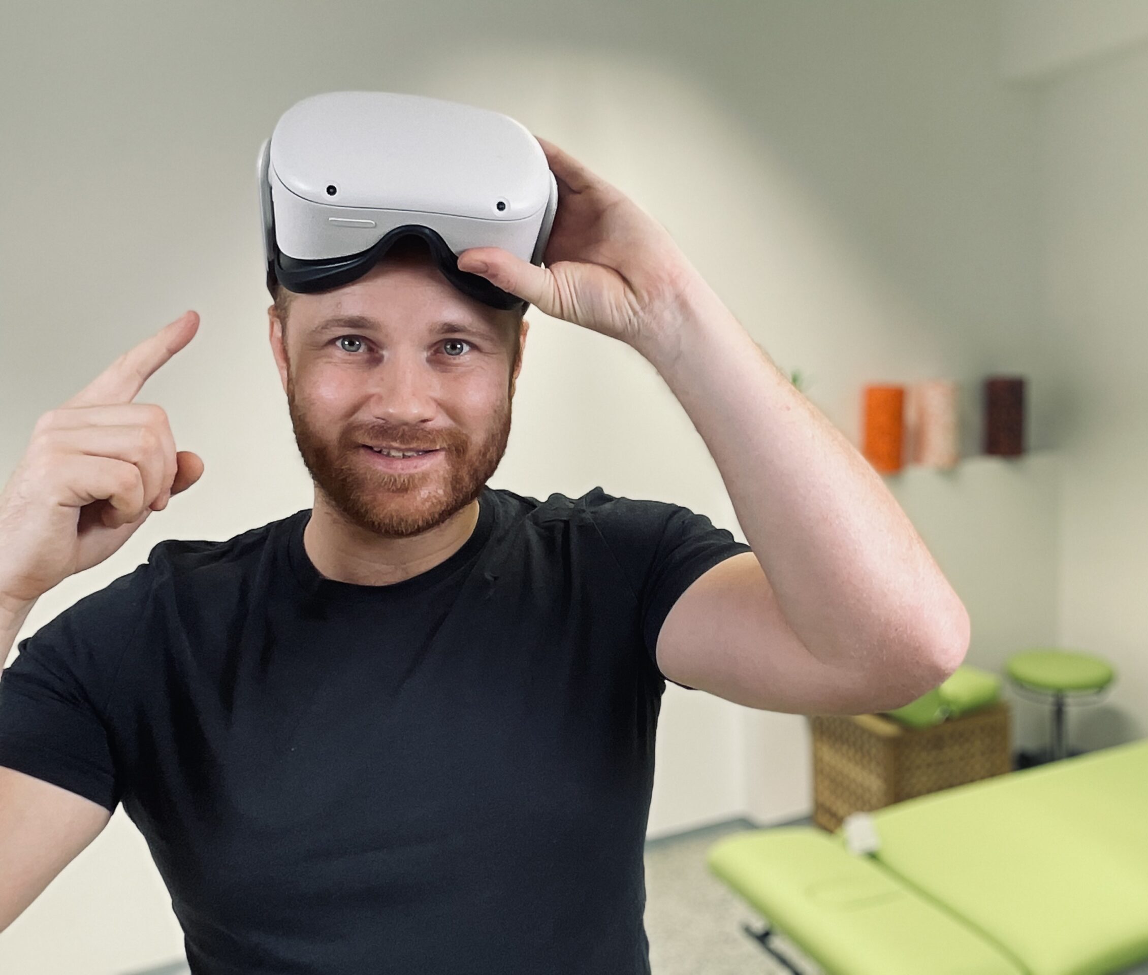 Georg Teufl-Keil with a Meta Quest headset pushed up on his forehead